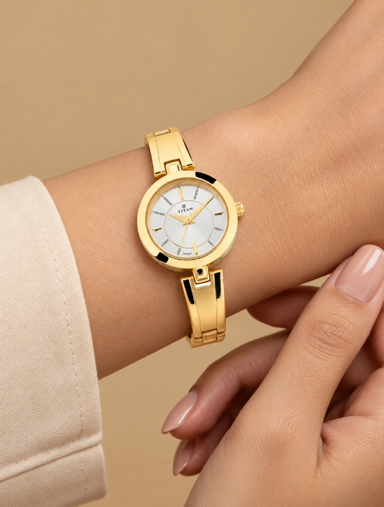 Titan Quartz Analog Silver Dial Golden Metal Strap Watch For Women NN2598YM02